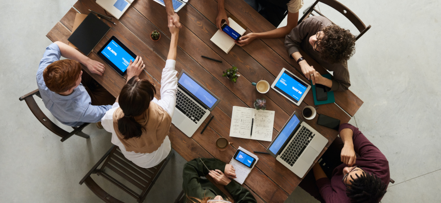 people sitting at a meeting table